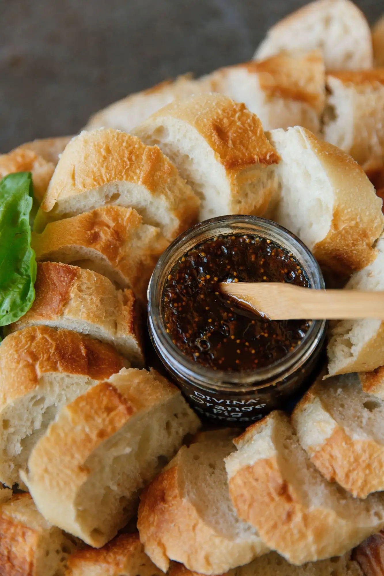 Sliced French baguette with fig spread, pepper jelly and honey (view 3)