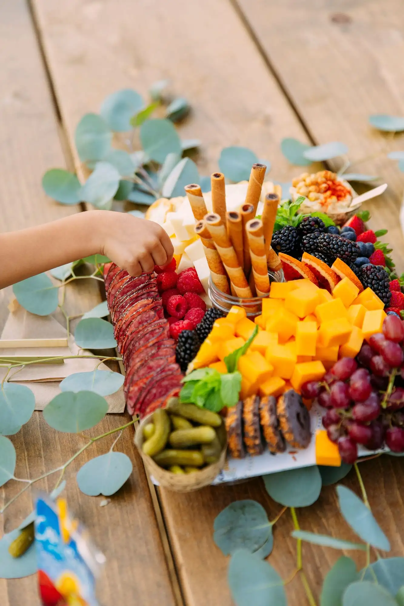 Kids grazing board with cheese sticks, fruit, cookies and crackers (view 5)