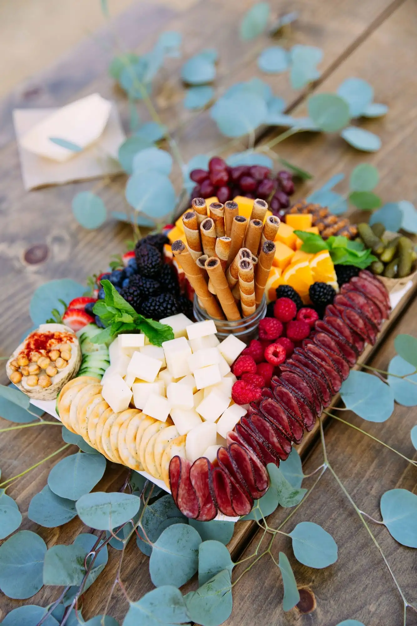 Kids grazing board with cheese sticks, fruit, cookies and crackers