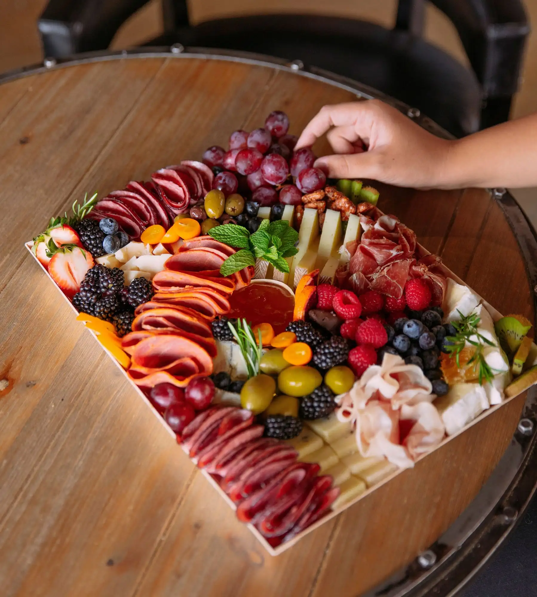 Wooden tray of cheeses, cured meats, fruit and honeycomb for 10 to 12 people (view 2)
