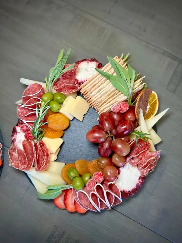 Small Christmas charcuterie wreath on a round board
