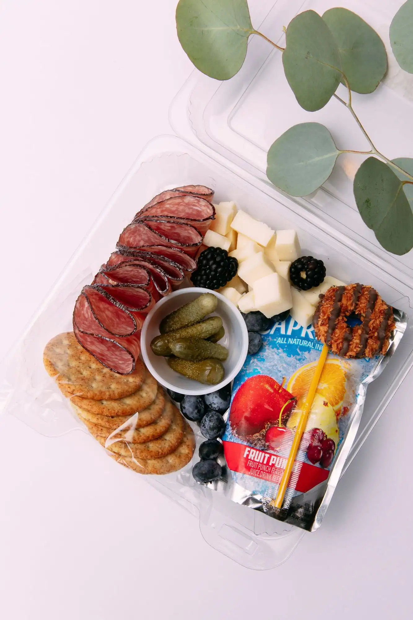 Kids snack box with cubed cheese, salami, crackers, fruit and a juice pouch (view 3)