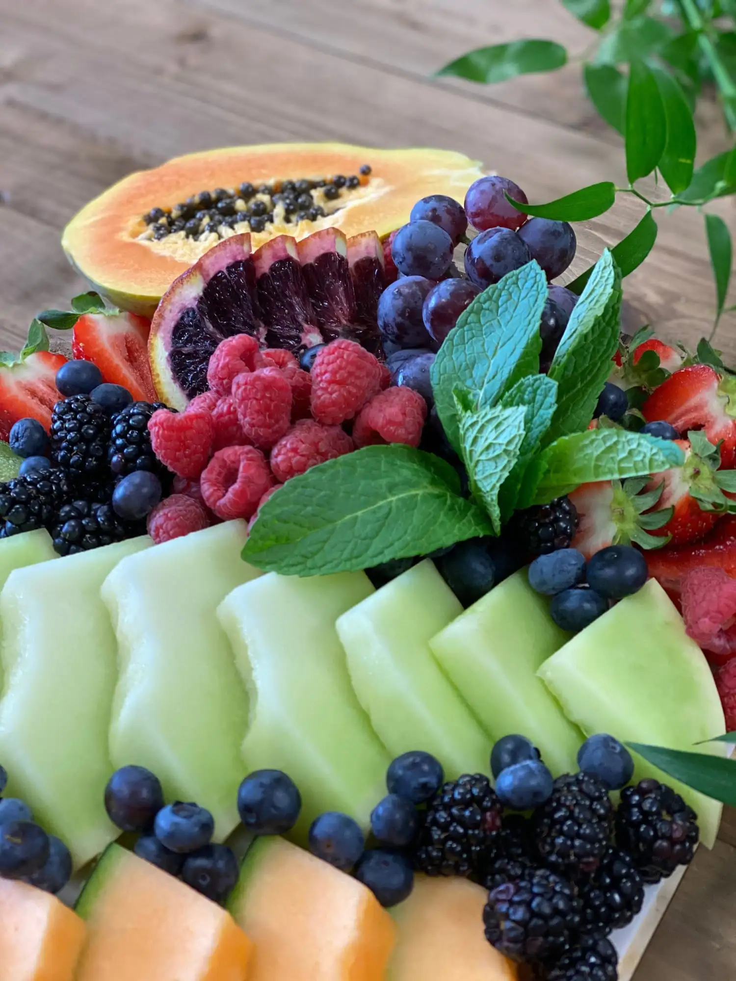 Long display of fresh seasonal fruit for 20 to 25 guests
