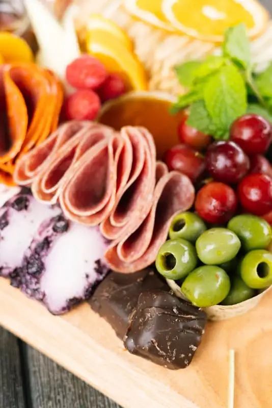 Bamboo board with three cheeses, cured meats, fruit and crackers for 4 to 6 people (view 5)