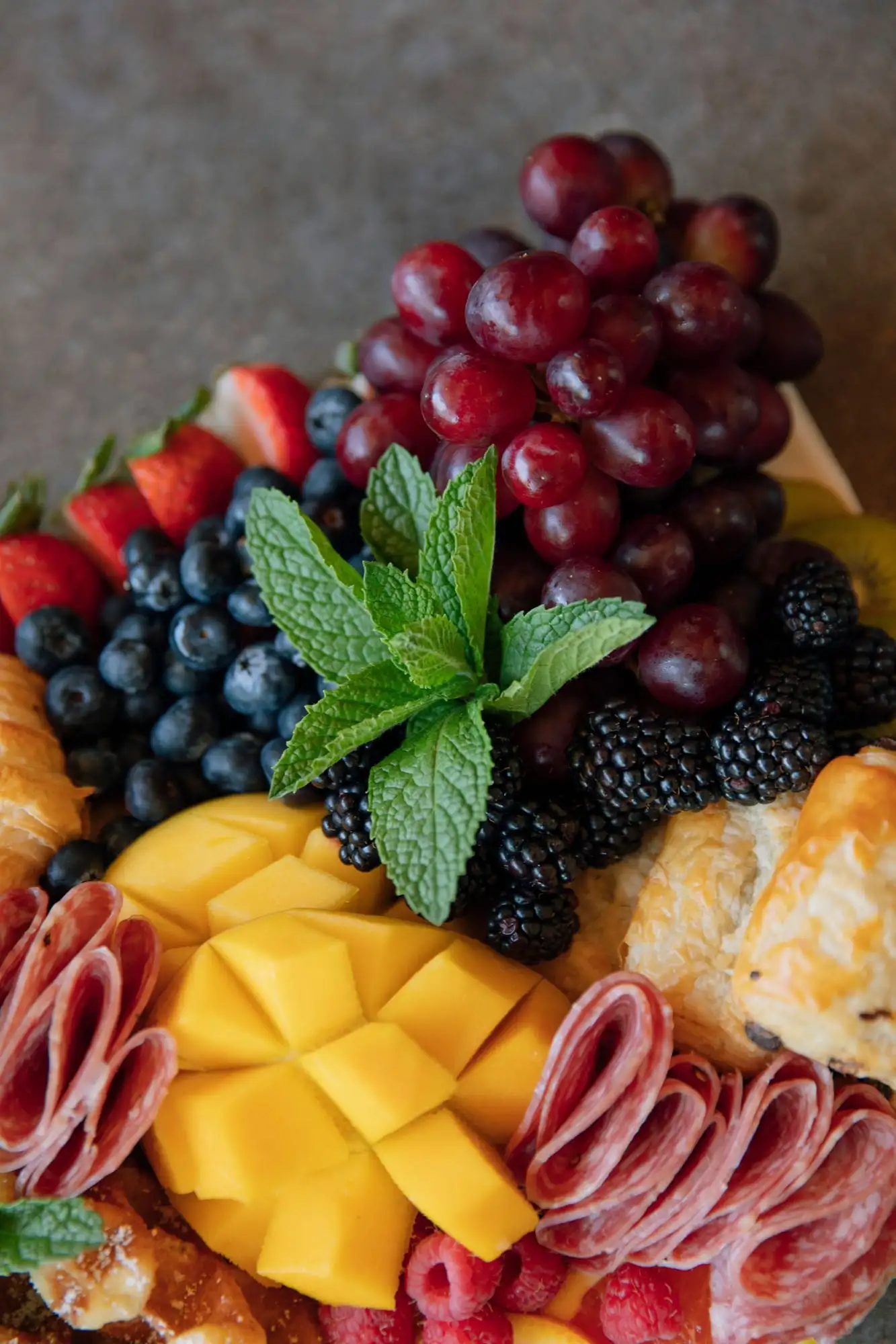 Brunch board with mini croissants, Belgian waffles, fresh fruit and salami (view 3)