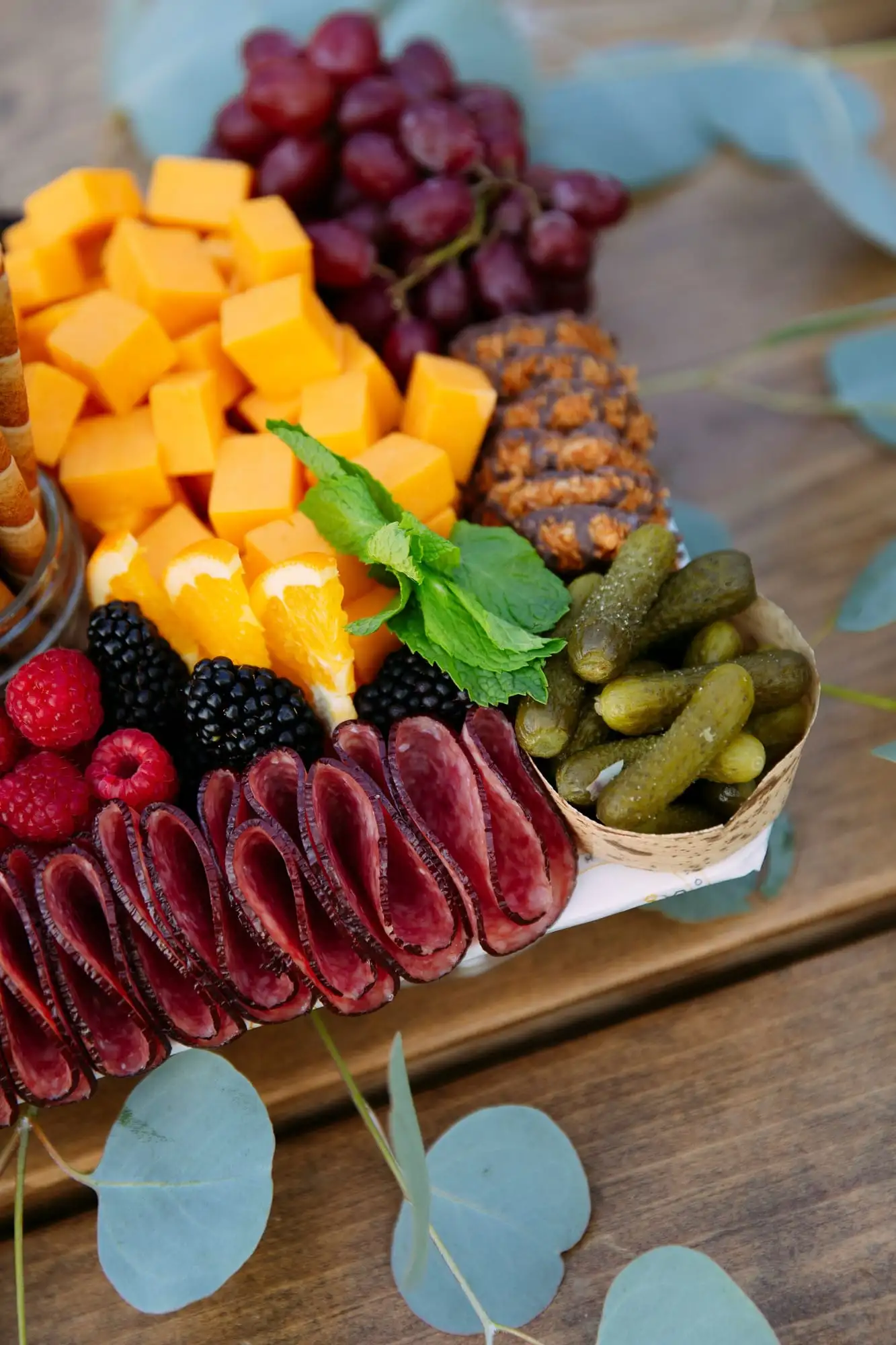 Kids grazing board with cheese sticks, fruit, cookies and crackers (view 2)
