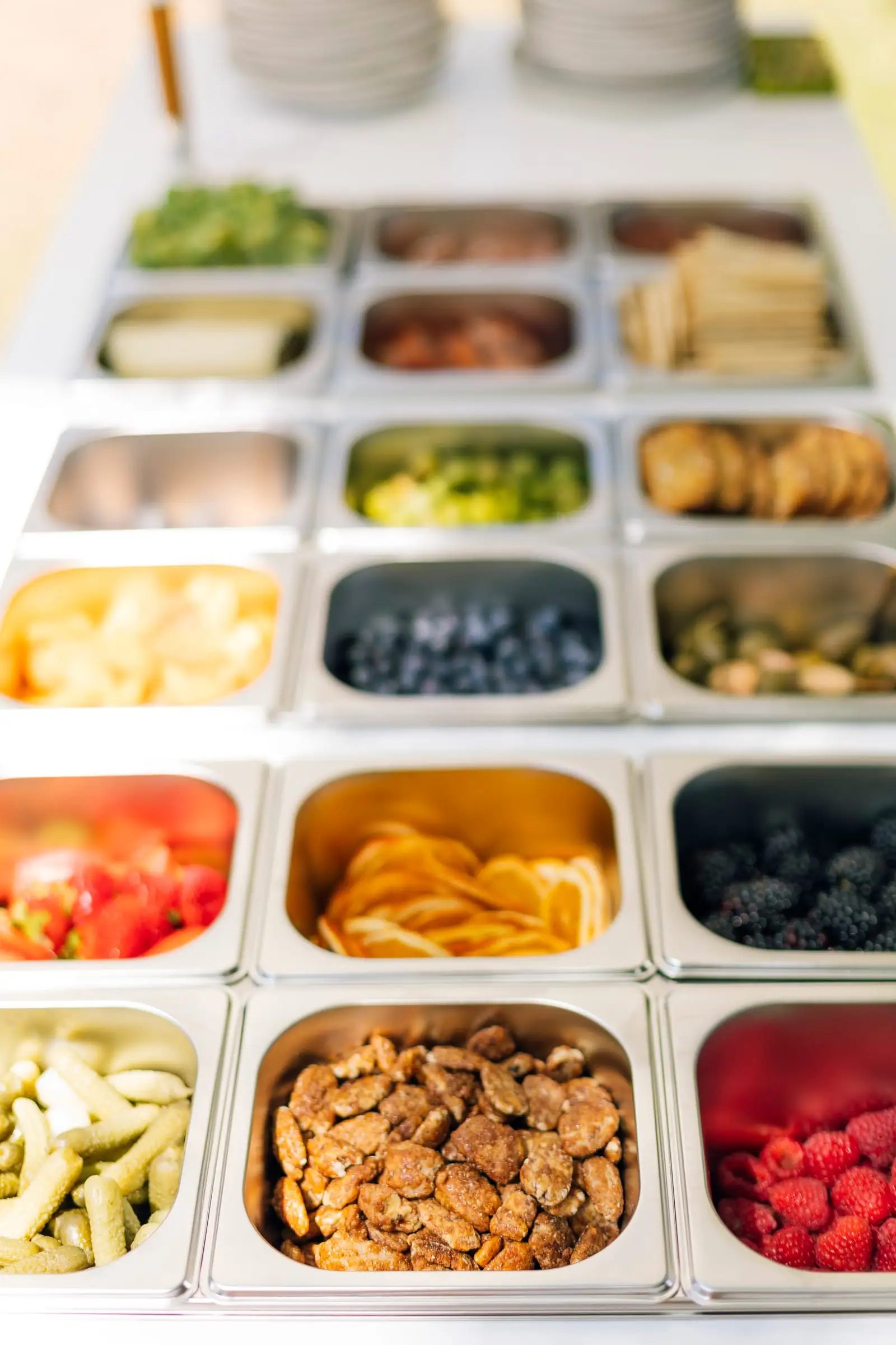 The cart's trays of cheese, fruit, nuts and pickles, from above