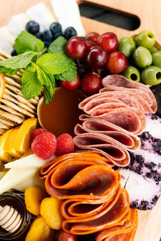 Bamboo board with three cheeses, cured meats, fruit and crackers for 4 to 6 people (view 6)