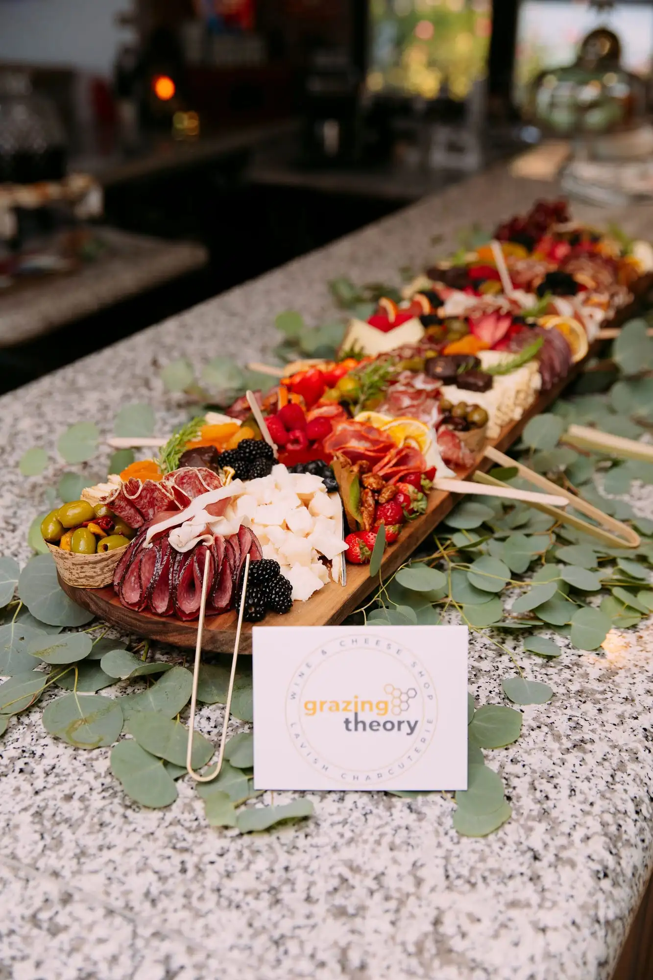 Long charcuterie board with cheeses, cured meats, fruit and chocolates for 30 guests (view 5)