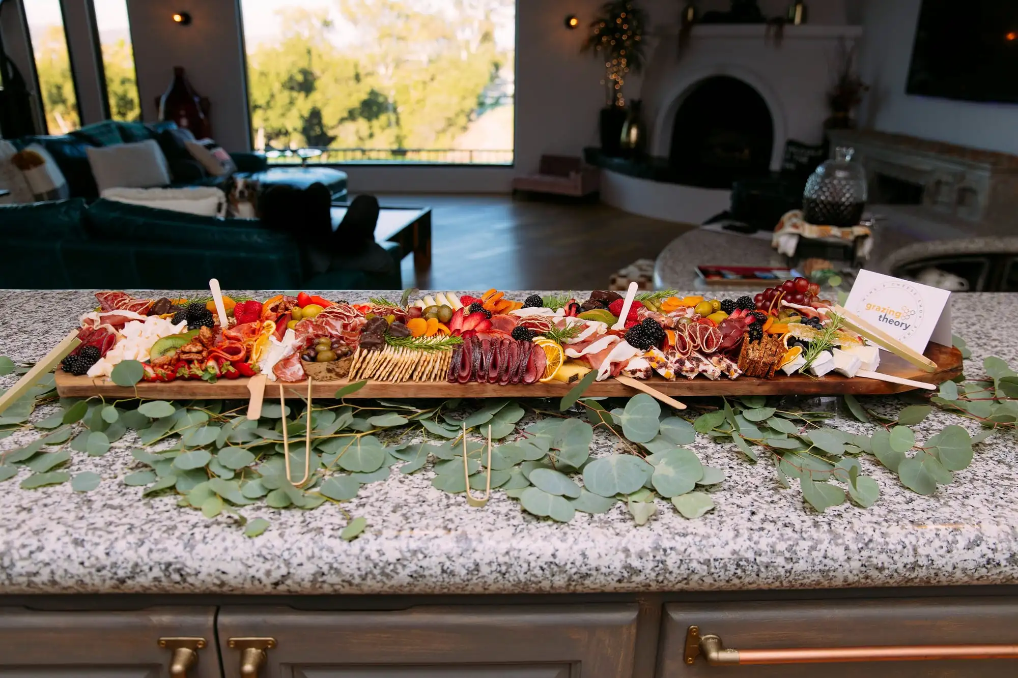 Long charcuterie board with cheeses, cured meats, fruit and chocolates for 30 guests (view 6)