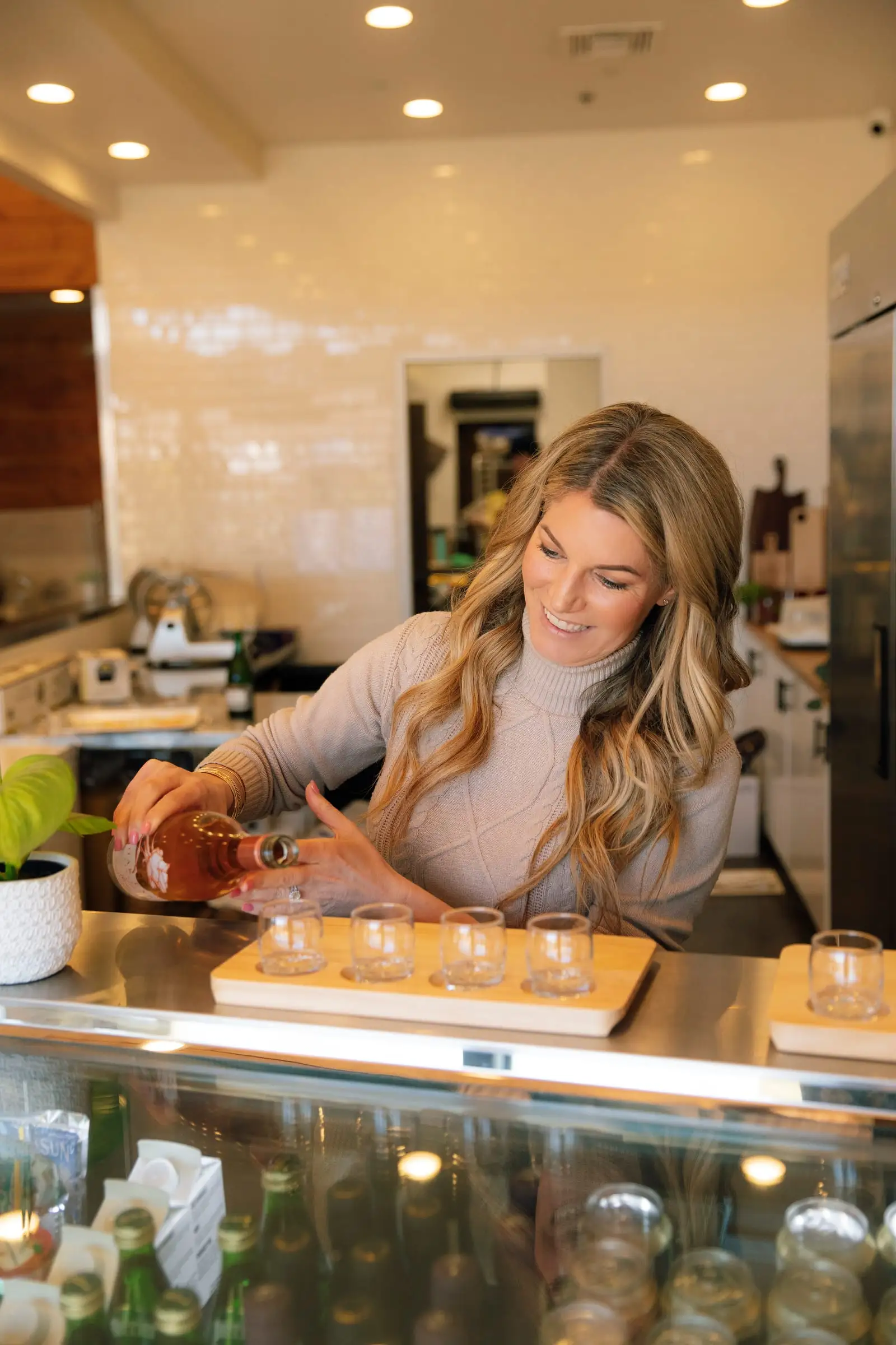 Gina pouring a tasting flight
